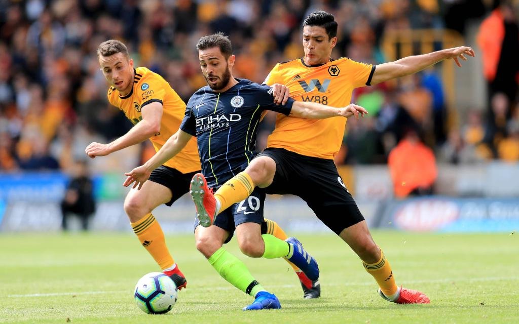 Wolverhampton Wanderers v Manchester City - Premier League - Molineux Manchester City s Bernardo Silva (centre) and Wolverhampton Wanderers Raul Jimenez battle for the ball