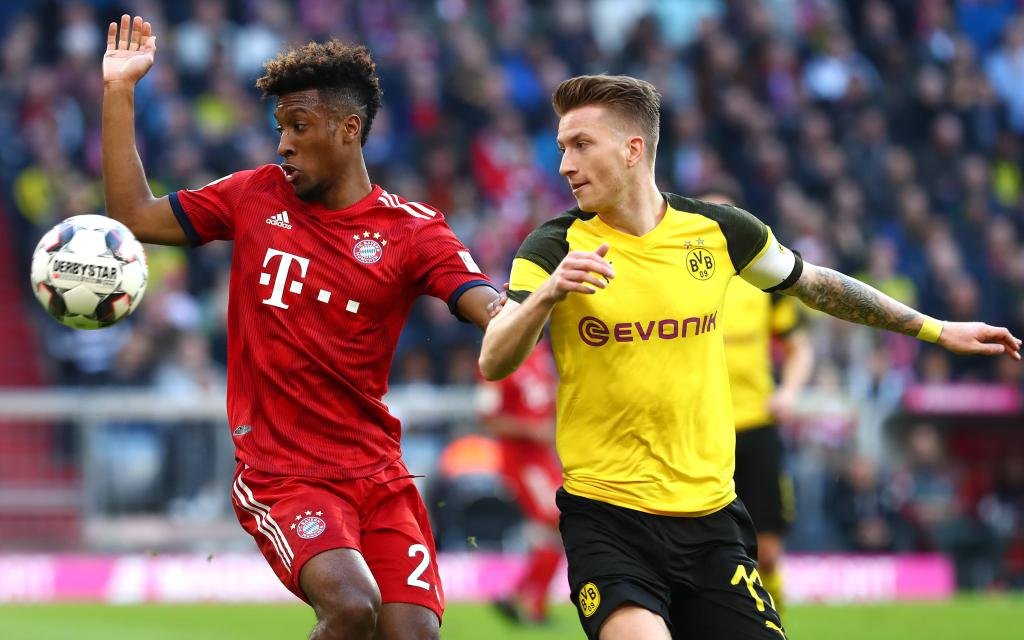 Samstag 06.04.2019, Saison 2018/2019, 1. Bundesliga, 28. Spieltag in der Allianz-Arena, FC Bayern München - BVB 09 Borussia Dortmund, Kingsley Coman (FCB) gegen Marco Reus (BVB)