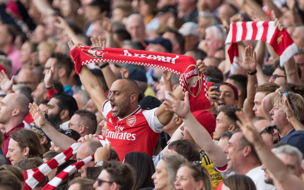 Football - 2019 / 2020 Premier League - Arsenal vs. Tottenham Hotspur Arsenal fans celebrate after their team scores the equaliser at The Emirates.